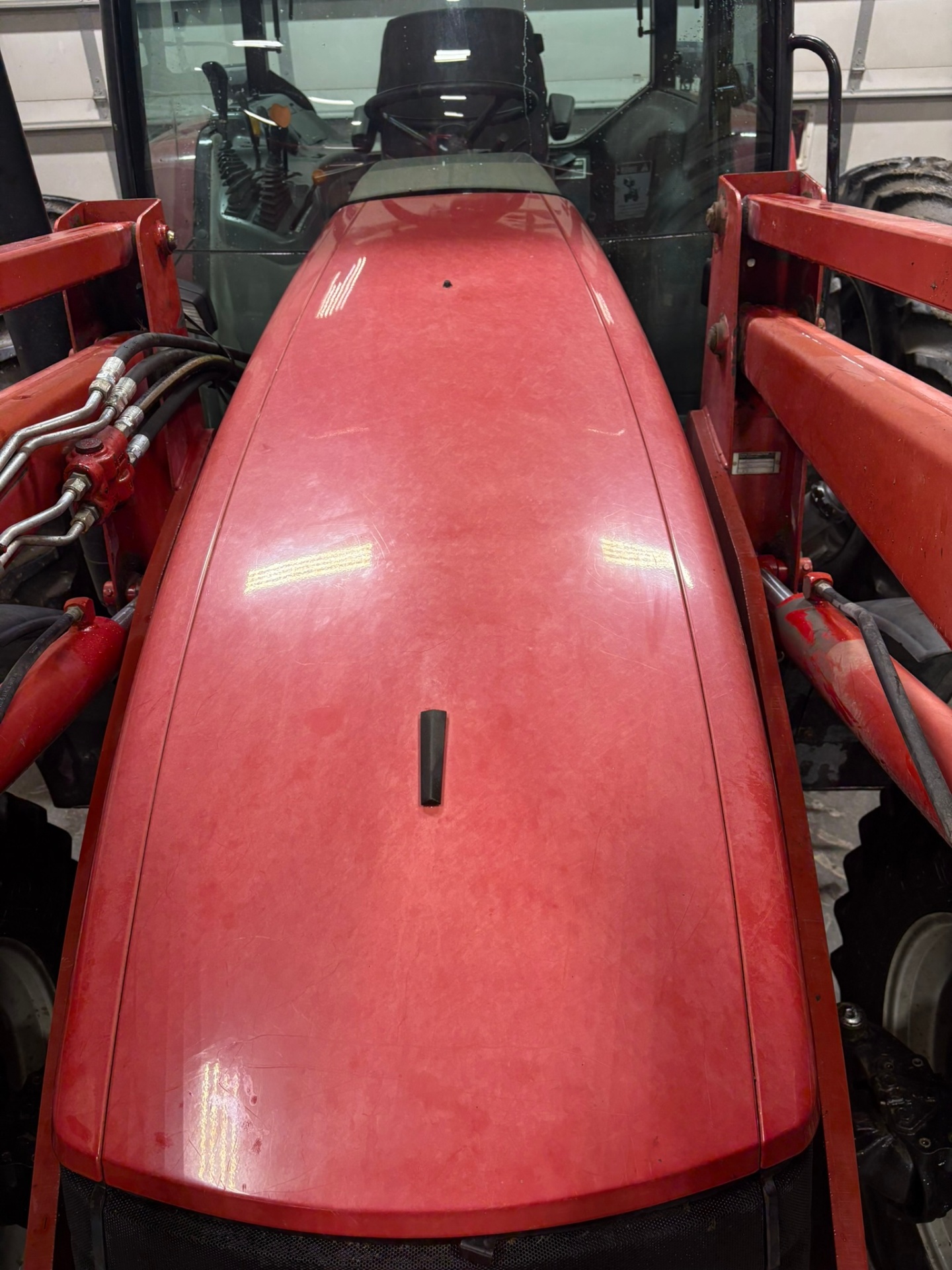 Oxidized faded red tractor hood